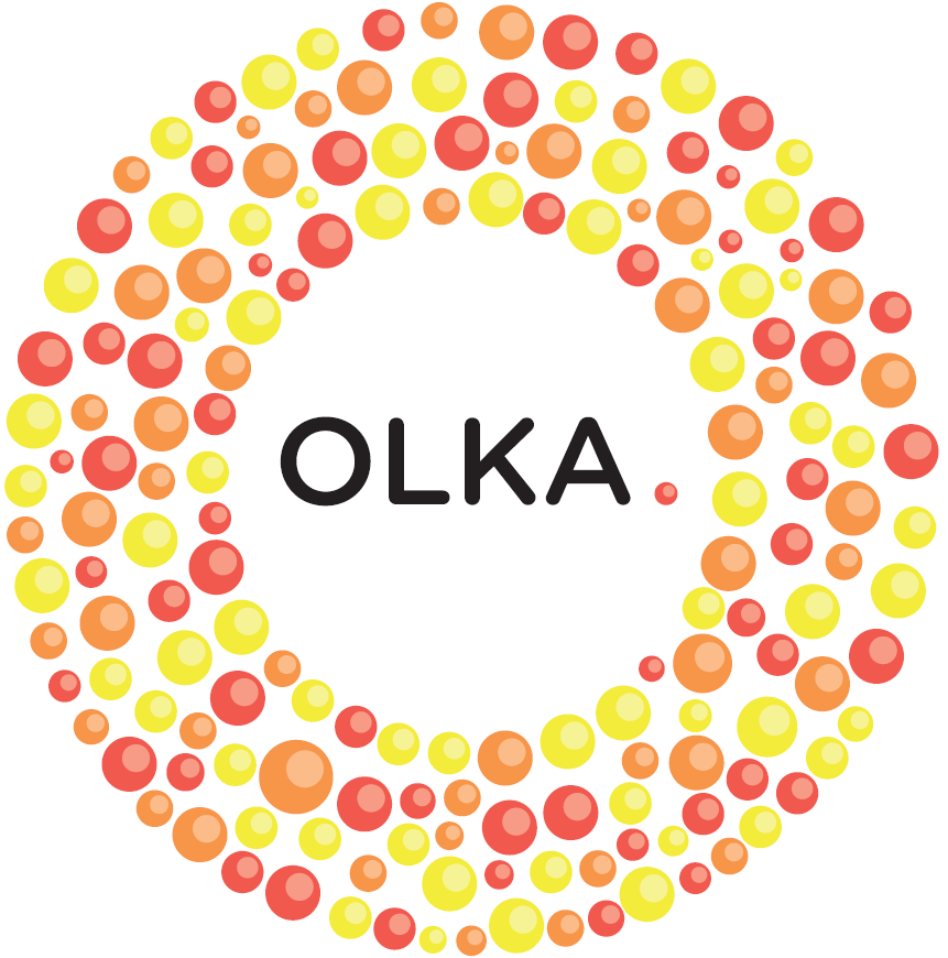 Oranssin, keltaisen ja punaisen värisiä pieniä ympyröitä joiden keskellä sana OLKA